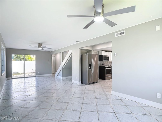 unfurnished room featuring light tile patterned flooring and ceiling fan