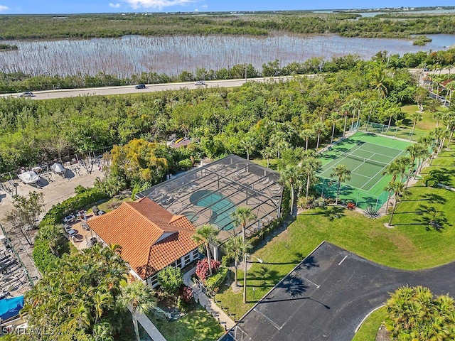 birds eye view of property with a water view