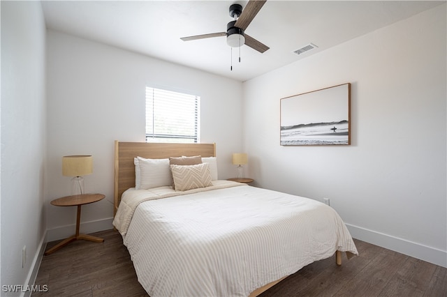 bedroom featuring ceiling fan and dark hardwood / wood-style floors