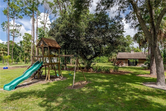 view of play area with a yard