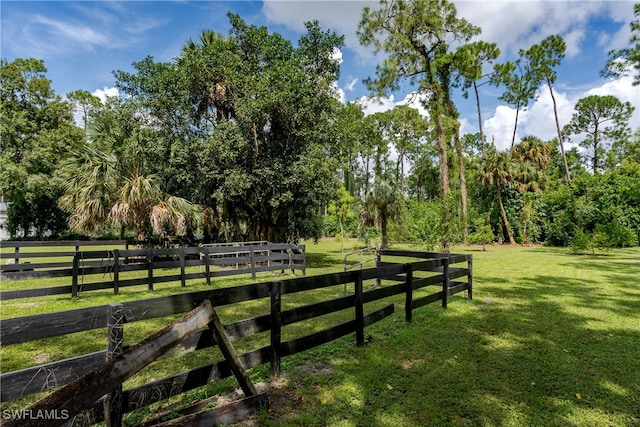 exterior space with a lawn and a rural view