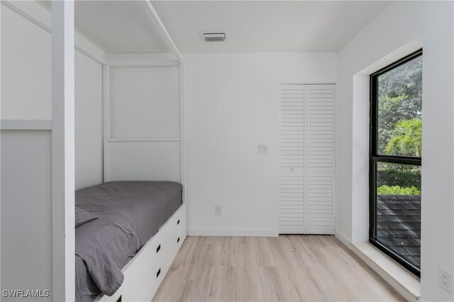 unfurnished bedroom featuring light hardwood / wood-style floors