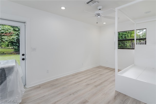 spare room with ceiling fan and light hardwood / wood-style flooring