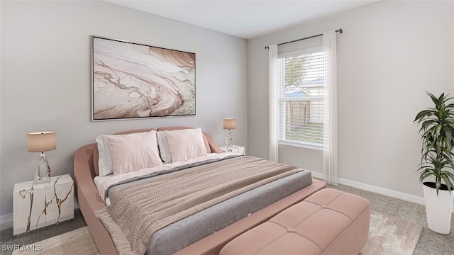 bedroom featuring multiple windows and light colored carpet