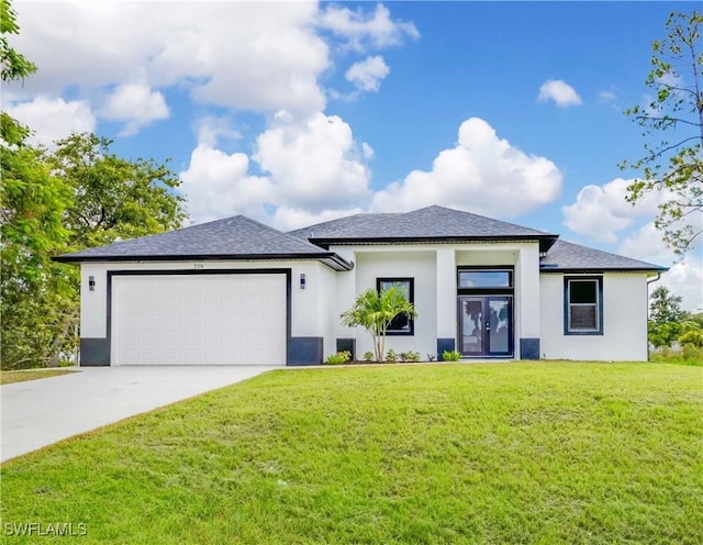 view of front of home with a garage and a front lawn