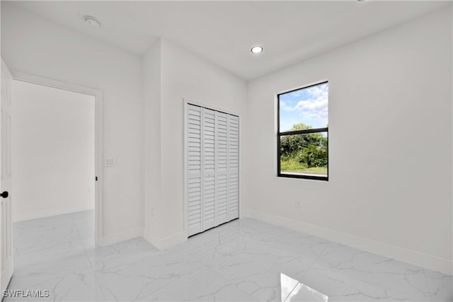 unfurnished bedroom featuring a closet