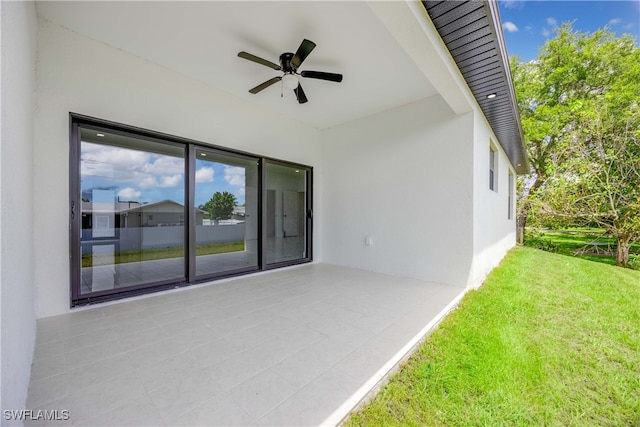 exterior space featuring ceiling fan