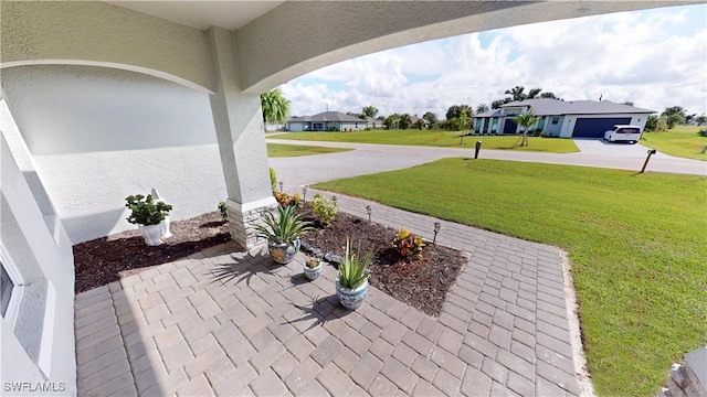 view of patio featuring a garage