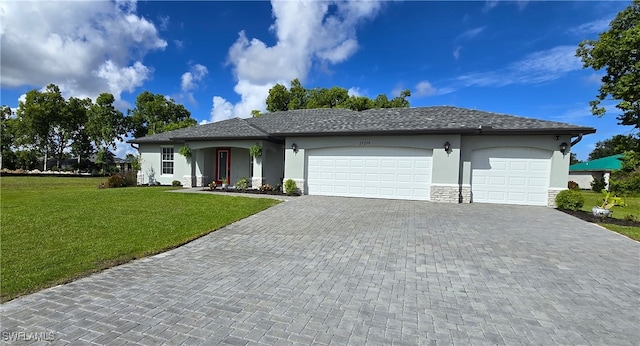 ranch-style home featuring a garage and a front yard