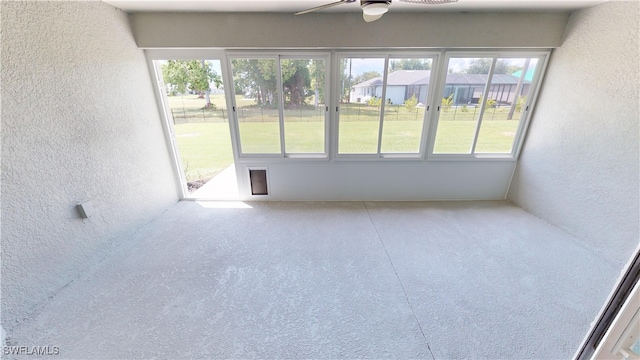 unfurnished room featuring ceiling fan