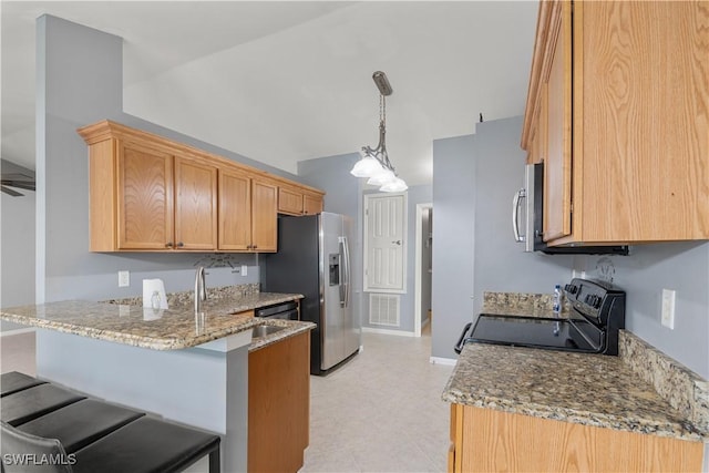 kitchen featuring a breakfast bar, hanging light fixtures, kitchen peninsula, stainless steel appliances, and light stone countertops