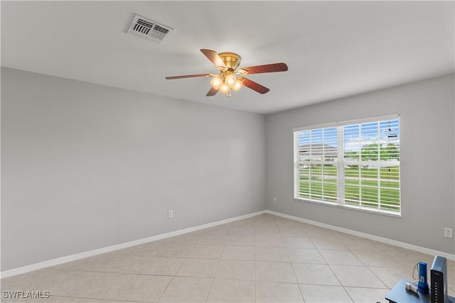 unfurnished room featuring light tile patterned floors and ceiling fan