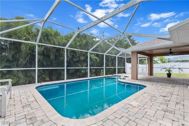 view of swimming pool featuring a lanai, a patio, and ceiling fan