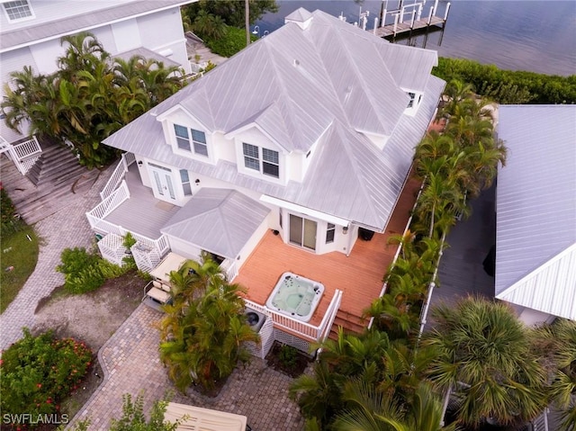 birds eye view of property with a water view