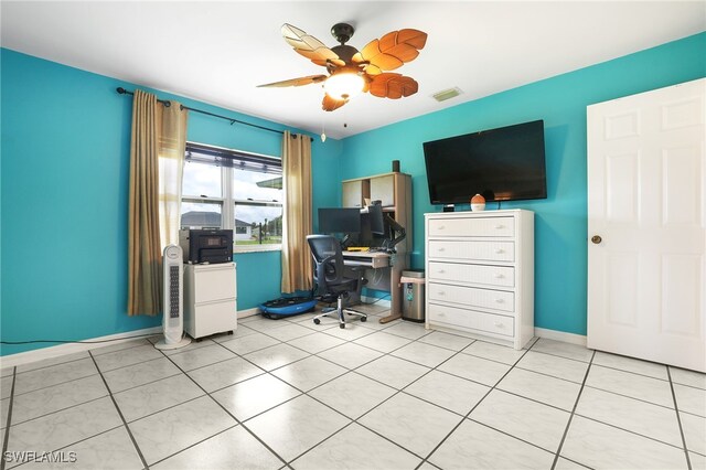 office area with ceiling fan and light tile patterned flooring