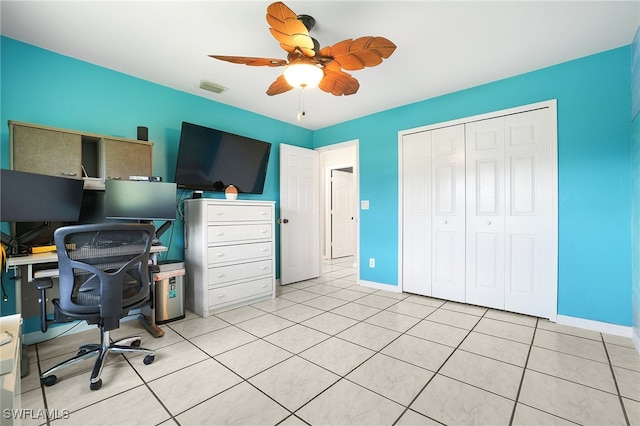 home office featuring ceiling fan and light tile patterned floors