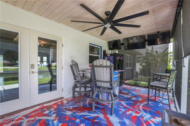 sunroom with french doors, a healthy amount of sunlight, and wooden ceiling