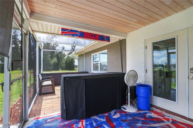 sunroom featuring wood ceiling