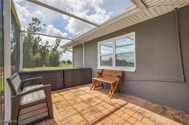 view of patio / terrace with glass enclosure