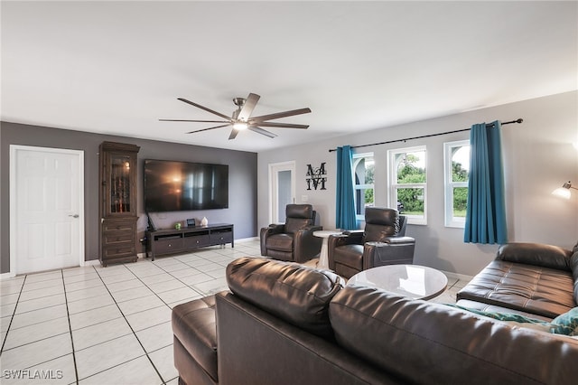 tiled living room with ceiling fan