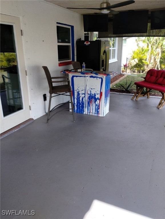 view of patio featuring ceiling fan