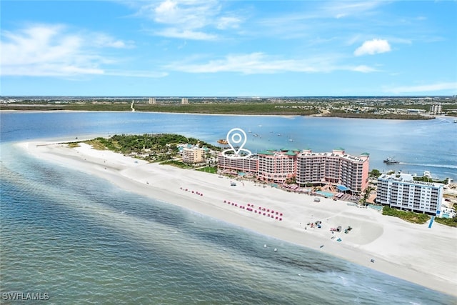 birds eye view of property with a water view and a view of the beach