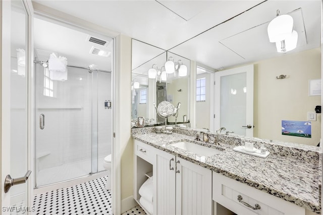 140 Estero Blvd Unit 2105, Fort Myers Beach, FL 33931 - bathroom featuring visible vents, a shower stall, toilet, and vanity