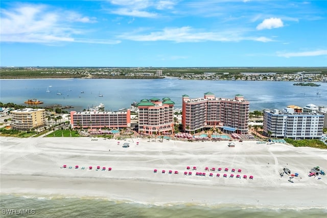 drone / aerial view featuring a water view and a beach view