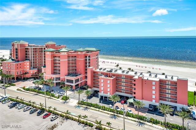 aerial view featuring a view of the beach and a water view