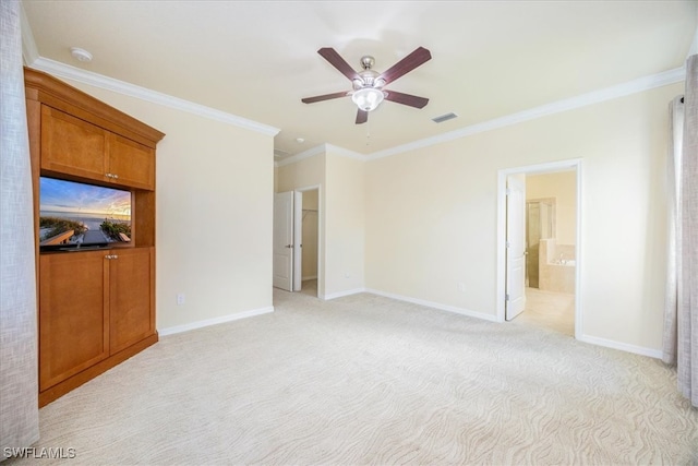 unfurnished living room with ceiling fan, ornamental molding, and light carpet