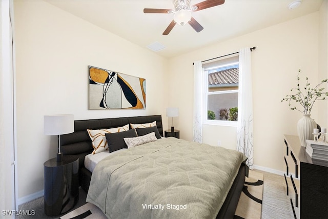 carpeted bedroom with ceiling fan