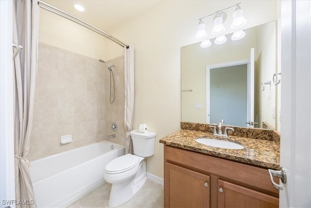 full bathroom with tile patterned floors, toilet, vanity, and tiled shower / bath