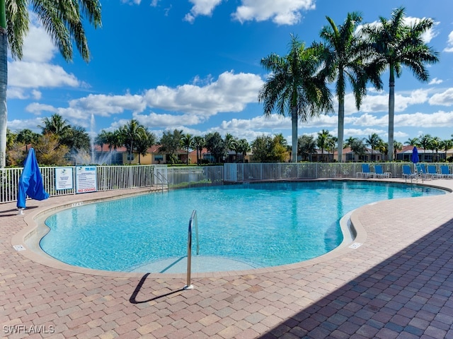 view of swimming pool featuring a patio area