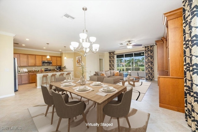 dining room featuring ceiling fan with notable chandelier, light tile patterned flooring, and ornamental molding