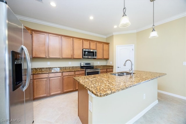 kitchen with sink, light stone countertops, an island with sink, appliances with stainless steel finishes, and decorative light fixtures