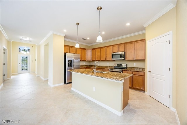 kitchen featuring sink, an island with sink, ornamental molding, and appliances with stainless steel finishes