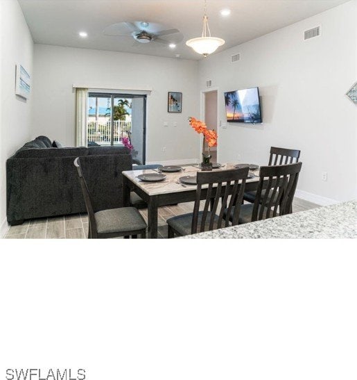 dining room featuring light hardwood / wood-style floors and ceiling fan