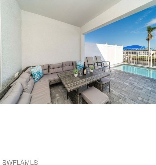 view of patio / terrace featuring a fenced in pool