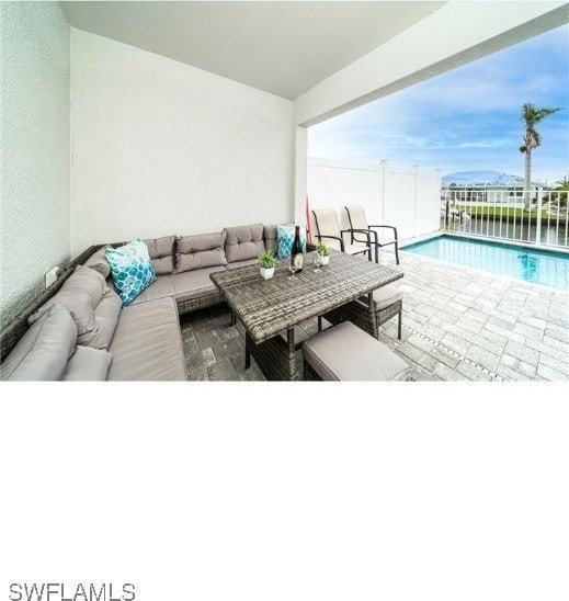 view of patio / terrace with an outdoor hangout area and a fenced in pool