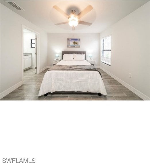 bedroom with ceiling fan, light hardwood / wood-style flooring, and connected bathroom