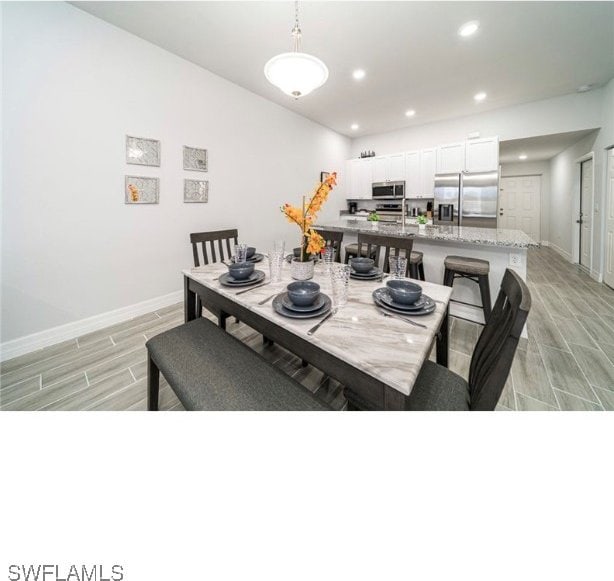 dining area with light hardwood / wood-style flooring