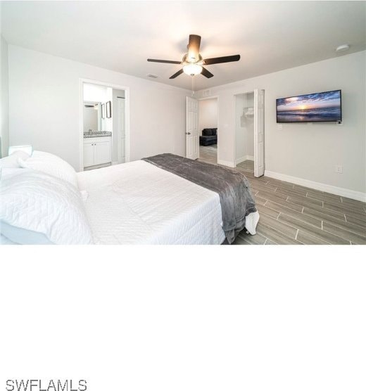 bedroom featuring wood-type flooring, ensuite bath, and ceiling fan