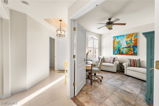 interior space featuring ceiling fan