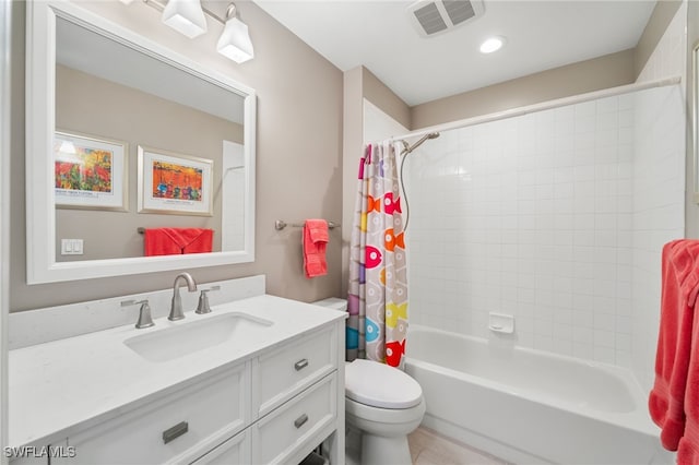 full bathroom with vanity, toilet, and shower / bath combo