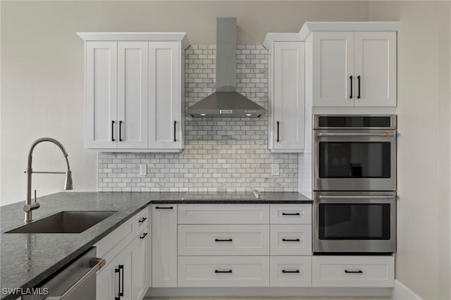 164 Colonade Cir Unit 1307, Naples, FL 34103 - kitchen with appliances with stainless steel finishes, a sink, wall chimney exhaust hood, and white cabinets