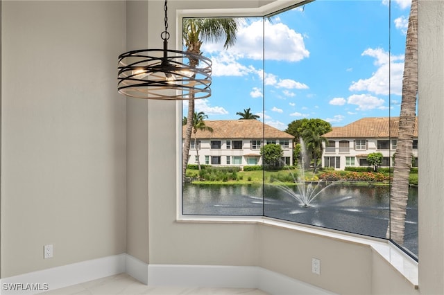 interior space with a water view and an inviting chandelier