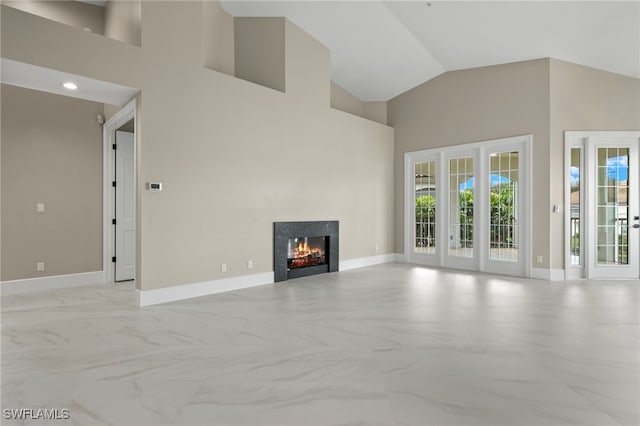 164 Colonade Cir Unit 1307, Naples, FL 34103 - unfurnished living room with baseboards, recessed lighting, a lit fireplace, high vaulted ceiling, and marble finish floor