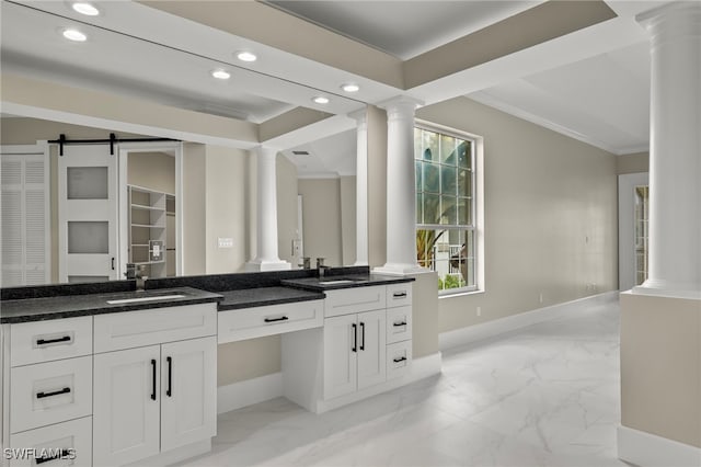 bathroom featuring ornamental molding, vanity, and decorative columns