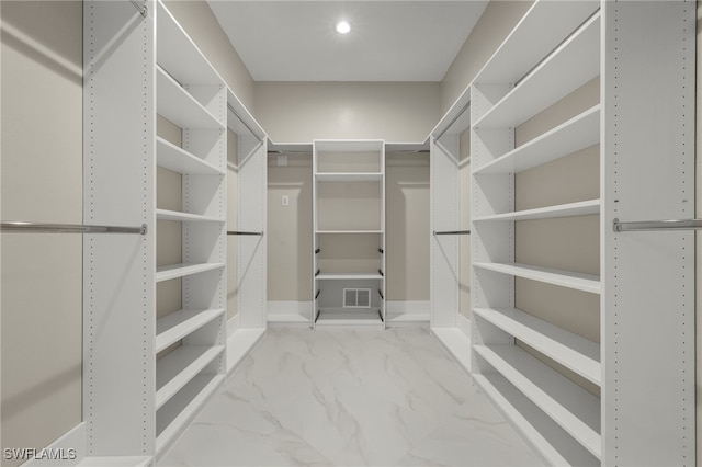 164 Colonade Cir Unit 1307, Naples, FL 34103 - walk in closet featuring visible vents and marble finish floor