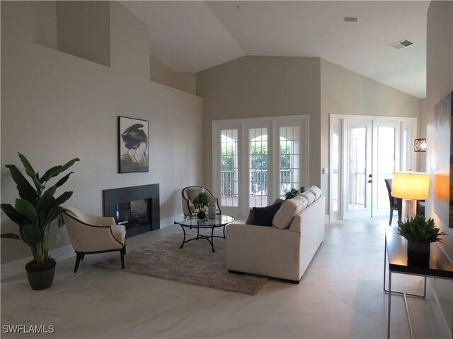 164 Colonade Cir Unit 1307, Naples, FL 34103 - living area with visible vents, high vaulted ceiling, and a multi sided fireplace